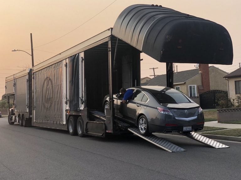 Enclosed Auto Transport Service - First Line Transport INC Enclosed auto transport trailer providing premium protection for luxury and classic vehicles